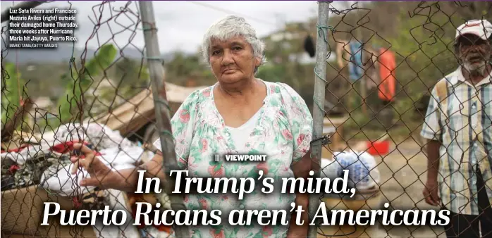  ?? MARIO TAMA/ GETTY IMAGES ?? Luz Sota Rivera and Francisco Nazario Aviles ( right) outside their damaged home Thursday, three weeks after Hurricane Maria hit Jayuya, Puerto Rico.