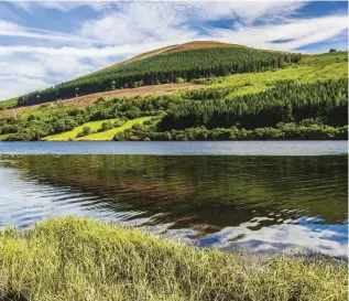  ??  ?? TOP LEFT Brinore Tramroad runs alongside Talybont Reservoir beneath the rounded summit of Tor y Foel (551m) TOP RIGHT The old tramroad shares part of its route with the 55-mile-long Taff Trail BOTTOM RIGHT The trams were made of wrought iron and sometimes clad with elm