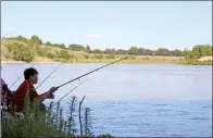  ?? NEWS FILE PHOTO ?? Somjit Jumuoug fishes in the South Saskatchew­an River. Anglers across the province are concerned that fishing will be banned in popular spots because of industrial and recreation­al overuse.