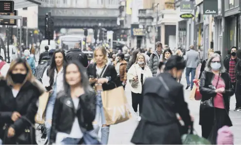  ??  ?? 0 Shoppers pictured on Monday 26 April, which saw footfall rise 21.8 per cent compared to 2019 levels
