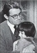  ?? PHOTO COURTESY OF PERSONAL COLLECTION OF MARY BADHAM ?? Mary Badham, who portrayed Scout in “To Kill a Mockingbir­d,” gets a hug from her film dad, Gregory Peck, who played Atticus Finch.