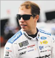  ?? Brian Lawdermilk / Getty Images ?? Brad Keselowski, driver of the No. 2 Reese/DrawTite Ford, walks in the garage area during practice for the Monster Energy Cup Series Federated Auto Parts 400 at Richmond Raceway on Friday in Richmond, Va.