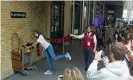  ?? Photograph: SCFotos - Stuart Crump Visuals //Alamy Stock Photo ?? Tourists recreate Harry Potter at King’s Cross station.