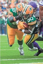  ?? EPA ?? Packers guard Lane Taylor helps make sure running back Jamaal Williams gets into the end zone Sunday.