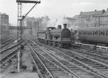  ?? A Donaldson/Kiddermins­ter Railway Museum ?? Ex-Caledonian Railway ‘3F’ 0-6-0 No 57559 – completed at St Rollox Works as McIntosh ‘812’ class No 821 in July 1899 – is viewed running light engine on the north side of Princes Street station on Monday, 16 August 1954. As one of the first batch of ‘812s’ this locomotive is Westinghou­se-fitted and was initially painted in ‘Caley’ blue livery, it being intended for express goods work. Dalry Roadbased when seen, and seemingly on hand at the terminus for empty coaching stock duties, this particular 0-6-0 would serve until September 1961.