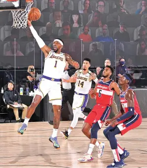  ?? GARRETT ELLWOOD/NBAE/GETTY IMAGES VIA AFP ?? MASIH PERKASA: Guard LA Lakers Kentavious Caldwell-Pope men-drive bola ke ring saat menghadapi Washington Wizards dalam scrimmage games di Visa Athletic Center, ESPN Wide World of Sports, dini hari kemarin WIB.