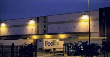  ?? Maddie Mcgarvey / New York Times ?? An Indianapol­is Fedex warehouse on Friday where there was a mass shooting Thursday night. The gunman in Thursday’s shooting killed eight people and injured at least seven others before killing himself, the police said.
