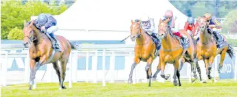  ?? - AFP photo ?? Jockey William Buick rides Ghaiyyath (left) to victory over Enable ridden by jockey Frankie Dettori and Japan ridden by jockey Ryan Moore in The Eclipse Stakes at Sandown, south-west of London.