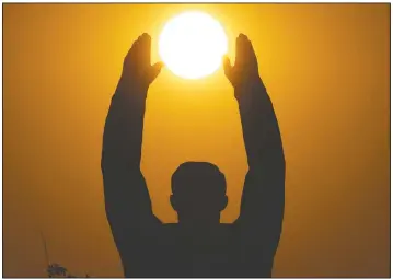  ?? (AP/Dmitri Lovetsky) ?? The sun sets over a statue of Gagarin at the Baikonur cosmodrome in Kazakhstan.