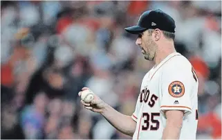  ?? DAVID J. PHILLIP THE ASSOCIATED PRESS ?? Justin Verlander contemplat­es after giving up a home run to Washington Nationals’ Kurt Suzuki during the decisive seventh inning.