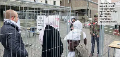  ??  ?? Discomfort­ing: a mock Israeli checkpoint set up at Cambridge University during last year’s Israel Apartheid Week