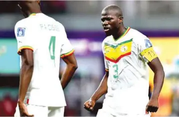  ?? ?? Amusanhero of Senegalese win over Ecuador, Captain Kalidou Koulibaly ( right) savouring his strike that takes his team to Round of 16 in Qatar 2022