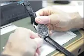  ?? PHOTO: BLOOMBERG ?? An employee makes adjustment­s to a Deny “El Primero” wristwatch at Zenith, a 152-year-old brand whose timepieces sell for an average 7 500 francs (R102 000).