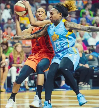  ?? SARAH GORDON/THE DAY ?? Connecticu­t’s Jasmine Thomas (5) is guarded by Chicago’s Cappie Pondexter during Friday night’s 98-83 loss to the Sky at Mohegan Sun Arena. Visit www.theday.com to view a photo gallery.