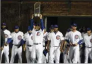  ?? DAVID BANKS — THE ASSOCIATED PRESS ?? Chicago Cubs first baseman Anthony Rizzo (44) carries the 2016 World Series Championsh­ip trophy before Monday night’s baseball game between the Chicago Cubs and the Los Angeles Dodgers at Wrigley Field.