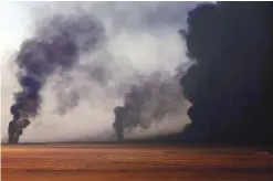  ??  ?? AL-QAYYARAH, Iraq: This file photo taken on November 25, 2016 shows smoke billowing from a burning oil well, set ablaze by retreating Islamic State (IS) group’s jihadists, in Qayyarah, some 60 kilometres (35 miles) south of Mosul. The battle to retake...