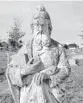  ?? SUN SENTINEL FILE ?? A saint statue surveys the scene at Westview Cemetery in Pompano Beach.