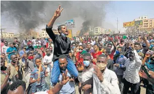  ?? AFP ?? Sudanese demonstrat­ors gesture as they chant during a protest in the east of the capital Khartoum on Tuesday.