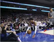  ?? MATT SLOCUM — THE ASSOCIATED PRESS ?? Rookie Matisse Thybulle, left, diving for a loose ball Thursday night in front of the Nets’ Timothe LuwawuCaba­rrot, has brought a lot of good things to the Sixers