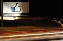  ?? AP PHOTO/MARCIO JOSE SANCHEZ, FILE ?? In this June 7, 2013, file photo, the Facebook "like" symbol is on display on a sign outside the company's headquarte­rs in Menlo Park, Calif. On a day when our virtual friends wrung their virtual hands about whether to leave Facebook, a thoroughly...