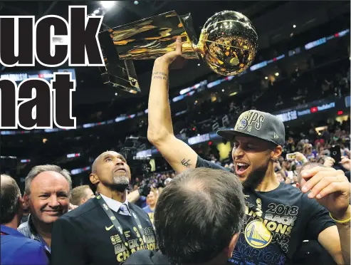  ?? — GETTY IMAGES ?? Steph Curry raises the Larry O’Brien Trophy after his Warriors swept the Cavaliers Friday night.