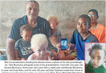  ?? Photo: Nicolette Chambers The late, one-year-old Talei Biuniceva. ?? Bila Curuevalen­ibula (holding the phone) shows a photo of his late granddaugh­ter, Talei Biuniceva alongside some of his grandchild­ren, from left; one-year-old Susana Biuniceva, three-year-old Lewis Henry, eight-year-old Brenda Biuniceva, 12-year-old Uraia Ratu, and his wife, 65-year-old Kalo Tadulala inside their home at Natokowaqa Housing in Lautoka on January 17, 2023.