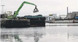  ?? AP ?? Newtown Creek, straddling Brooklyn and Queens, is home to a federal Superfund site the size of 55 football fields.