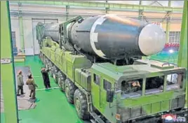  ?? REUTERS ?? Kim Jong Un with the newly developed Hwasong15 missile in an undated photo released by North Korea's Korean Central News Agency.