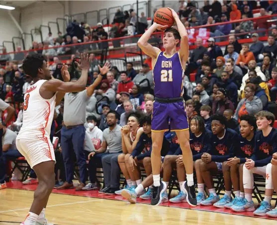  ?? ALLEN CUNNINGHAM/SUN-TIMES ?? Jack Stanton scored 20 points to lead Downers Grove North in their victory Tuesday against Young in the semifinals of the Hinsdale Central Sectional.