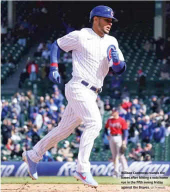  ?? GETTY IMAGES ?? Willson Contreras rounds the bases after hitting a solo home run in the fifth inning Friday against the Braves.