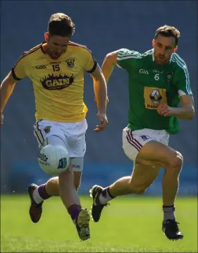  ??  ?? P.J. Banville on the move as Kevin Maguire of Westmeath gives chase.