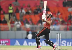  ?? (AFP) ?? Sunrisers Hyderabad’s Nitish Kumar Reddy watches the ball after playing a shot during the Indian Premier League match against Punjab Kings in Mohali yesterday.