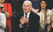  ?? ASSOCIATED PRESS FILE PHOTO ?? White House Chief of Staff John Kelly applauds President Donald Trump at the Jan. 30 State of the Union address. Kelly told a small group of reporters Tuesday at the Capitol that Dreamers would not be a priority for deportatio­n.