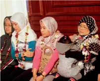  ?? Reuters ?? Filipino nurses, who were freed from Daesh militants by Libyan forces in Sirte, sit together during a handover ceremony in the presence of a Filipino envoy in Tripoli, Libya. —