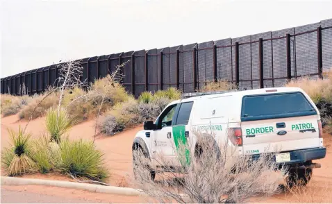  ?? RUSSELL CONTRERAS/ASSOCIATED PRESS ?? A U.S. Border Patrol vehicle drives along the border fence in Santa Teresa, N.M.