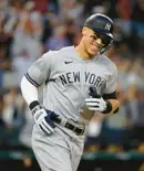  ?? DREAMSTIME ?? Aaron Judge of the New York Yankees rounds the bases on Oct. 4 after hitting his American-League record 62nd home run of the season.