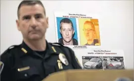  ?? Photograph­s by Kathy Plonka Spokesman-Review ?? LEE WHITE, police chief of Coeur d’Alene, Idaho, talks to reporters in March. Behind him is a photo of Kyle Odom, a veteran arrested in the shooting of a pastor.