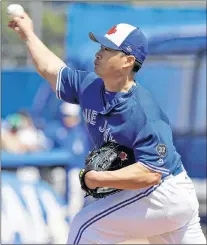  ?? A PHOTO ?? Toronto Blue Jays relief pitcher Seung-hwan Oh, of South Korea, delivers to the Philadelph­ia Phillies during the fifth inning of a spring training game Wednesday in Dunedin, Fla.