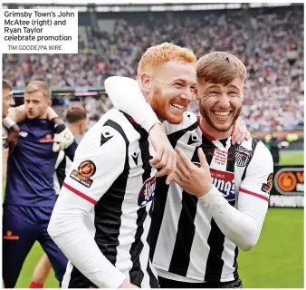  ?? TIM GOODE/PA WIRE ?? Grimsby Town’s John McAtee (right) and Ryan Taylor celebrate promotion