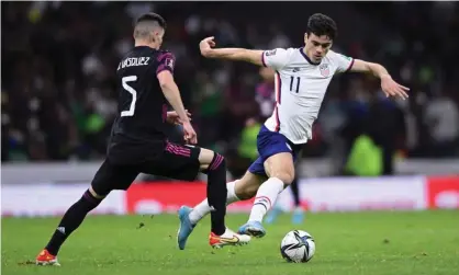  ?? Photograph: Orlando Ramirez/USA Today Sports ?? Gio Reyna of the United States (11) takes on Mexico defender Johan Vazquez (5) during the second half of Thursday’s World Cup qualifying match in Mexico City.