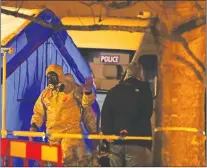  ?? AP PHOTO ?? Investigat­ors next to a police tent outside The Mill public house at the Maltings in Salisbury, England, Tuesday, March 6, 2018, near to where former Russian double agent Sergei Skripal was found critically ill.