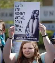  ?? The Associated Press ?? Q A protester stands in solidarity with rape victims on the campus of Brigham Young University during a sexual assault awareness demonstrat­ion on April 20, 2016, in Provo, Utah.