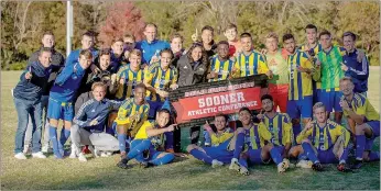  ?? Photo courtesy of JBU Sports Informatio­n ?? John Brown University men’s soccer players celebrate after defeating Southweste­rn Christian (Okla.) to win the Sooner Athletic Conference regular season championsh­ip on Saturday afternoon at Alumni Field. It’s JBU’s first regular season league title in 25 years in the league.