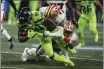  ?? STEPHEN BRASHEAR — THE ASSOCIATED PRESS FILE ?? Seattle Seahwks wide receiver D.K. Metcalf dives for extra yards as he is tackled by San Francisco 49ers defensive back Ji'Ayir Brown and defensive back Charvarius Ward, right, on Nov. 23 in Seattle.