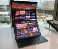 ?? ?? The Yoga Book 9i is a luxurious 2-in-1 laptop with two stunning 13.3-inch 2.8K OLED screens.