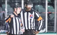  ?? Andy Nietupski / Texas Stars / Contribute­d Photo ?? AHL official Jordan Samuels-Thomas, right, a former Quinnipiac standout and AHL player, speaks with another official during a game on Feb. 26.