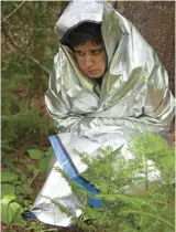  ??  ?? Being lost in the woods can be a terrifying experience, but having some survival gear, such as an emergency blanket, can be a lifesaver. Photo: Rushtonhea­ther/Dreamstime.com