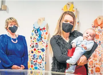  ??  ?? DRESS TO IMPRESS: Kindred Clothing member Kayleigh Mitchell with baby son Ryder Lafferty and V&A learning team textile designer Syrah Jay. Picture by Mhairi Edwards.