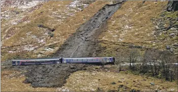  ?? IF F04 railwaylan­dslide07 ?? Investigat­ors say the landslip at Loch Eilt, near Glenfinnan, was caused by heavy rainfall and a rapid thaw.