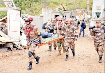  ??  ?? US Army and China’s PLA military personnel taking part in the disaster relief drills near Nanjing, Jiangsu province, China. — Reuters photos